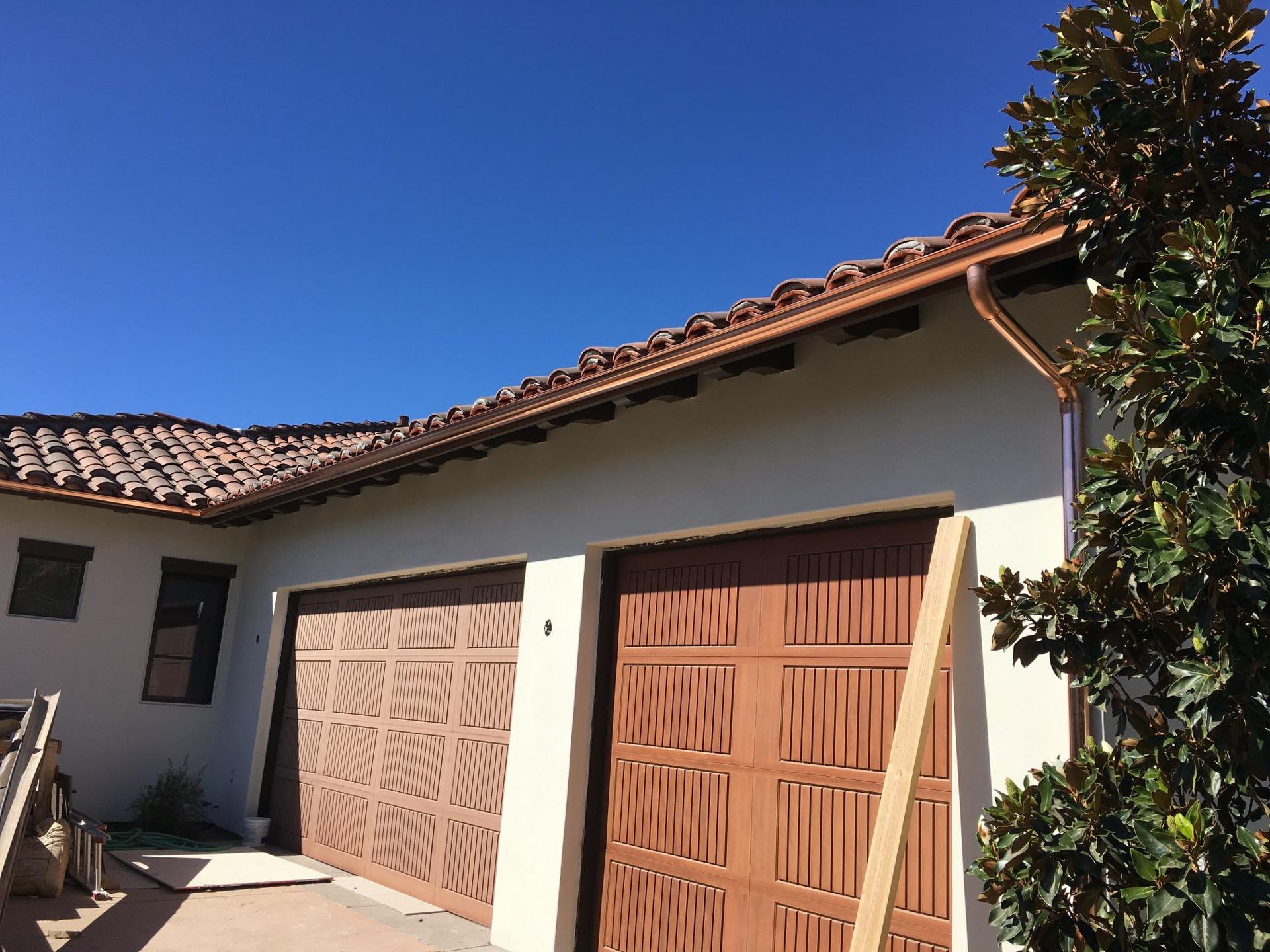 A copper gutter on the side of a house