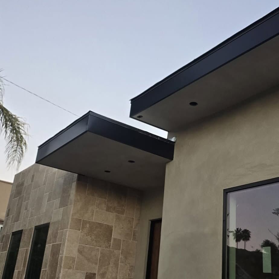 A house with a roof that has a canopy over it