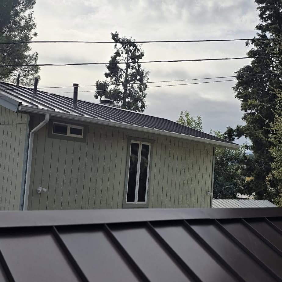 A house with a metal roof and a window