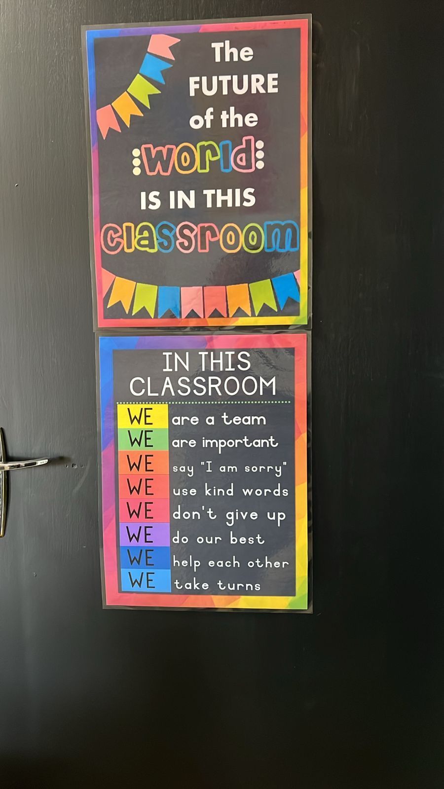 Two posters on a door that say the future of the world is in this classroom