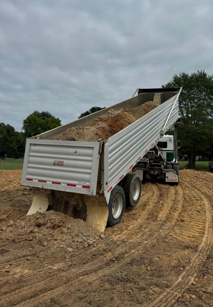 excavating truck hauling dirt