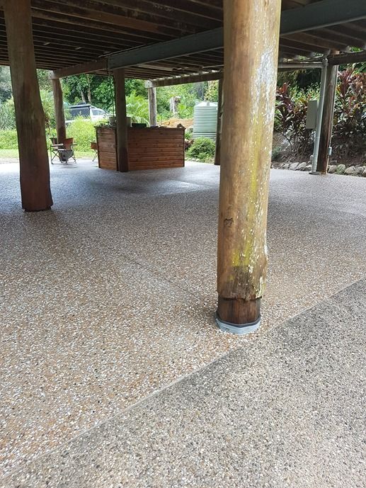 A Wooden Structure With A Concrete Floor Underneath It — B & C Donnachie Concrete Contractors in Mareeba, QLD