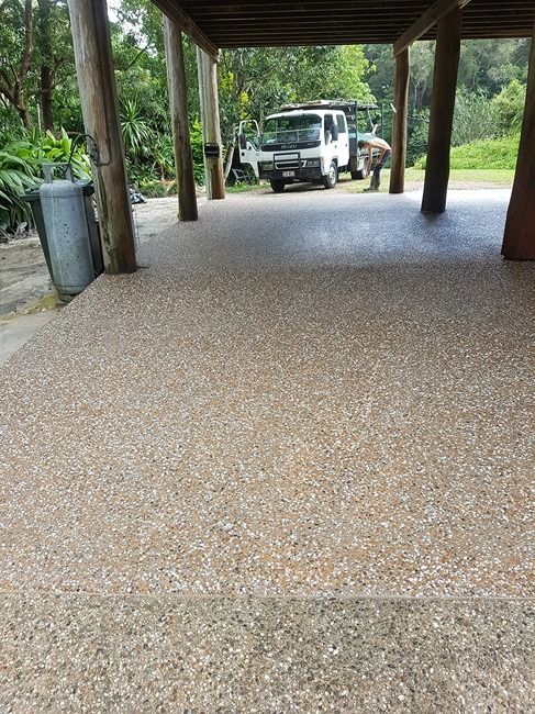 A Truck Is Parked Under A Covered Driveway — B & C Donnachie Concrete Contractors in Atherton, QLD