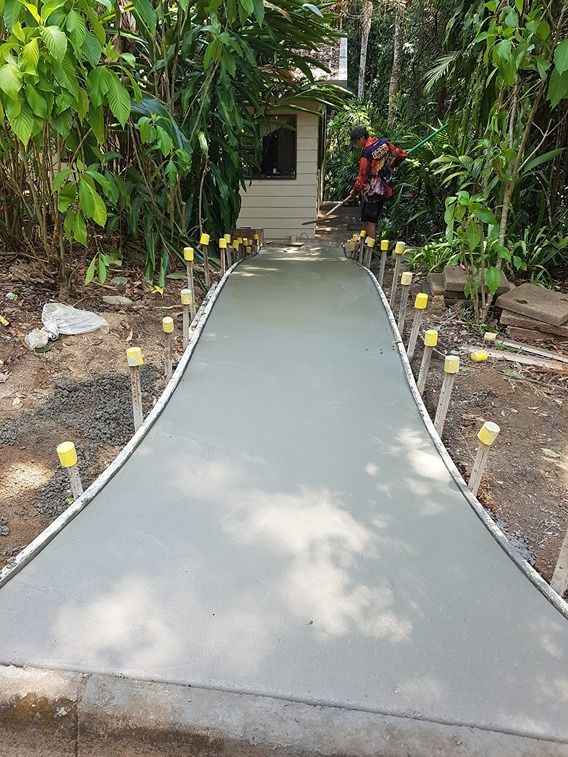 A Concrete Walkway Is Being Built In The Middle Of A Forest — B & C Donnachie Concrete Contractors in Kuranda, QLD