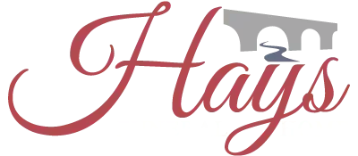 The word "Hays" in a red, stylized script font, with a grey stone bridge icon featuring a small blue river underneath.