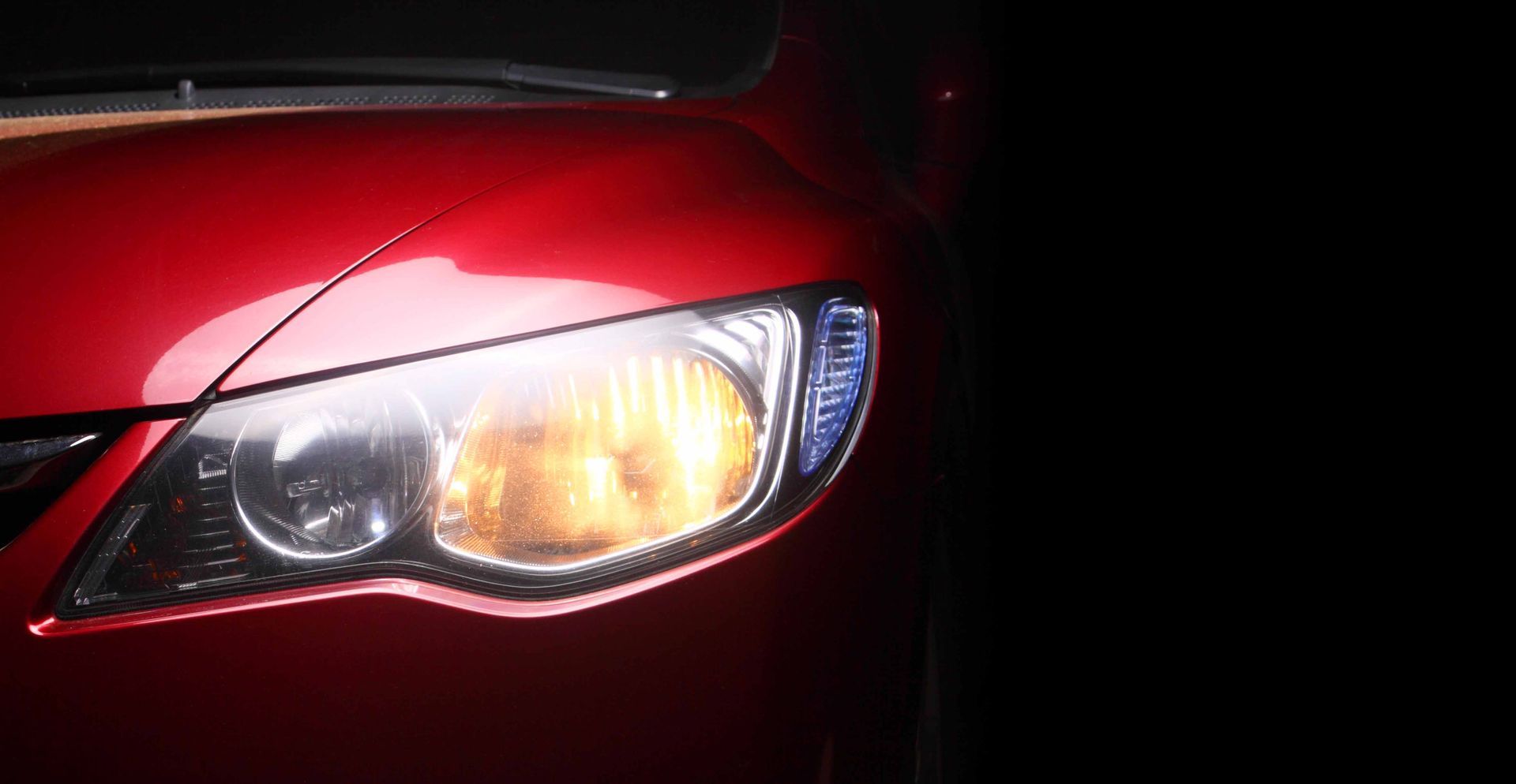 The Headlight Of A Red Car — Hyattsville, MD — Rivas Auto Glass