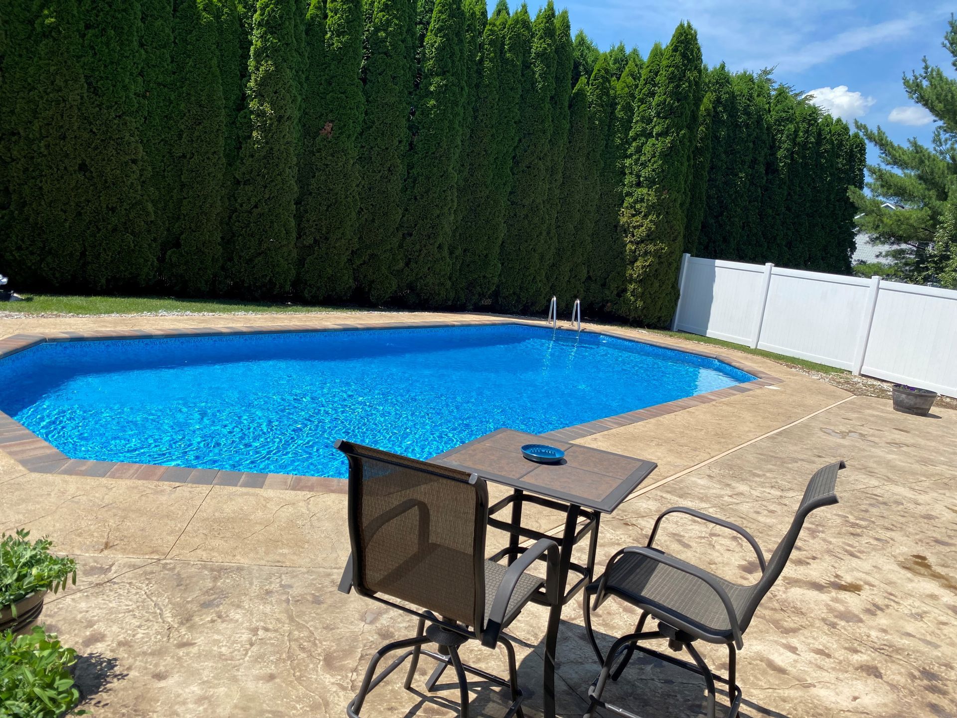 A Patio With A Table And Chairs — Menasha, WI — Artscapes COC