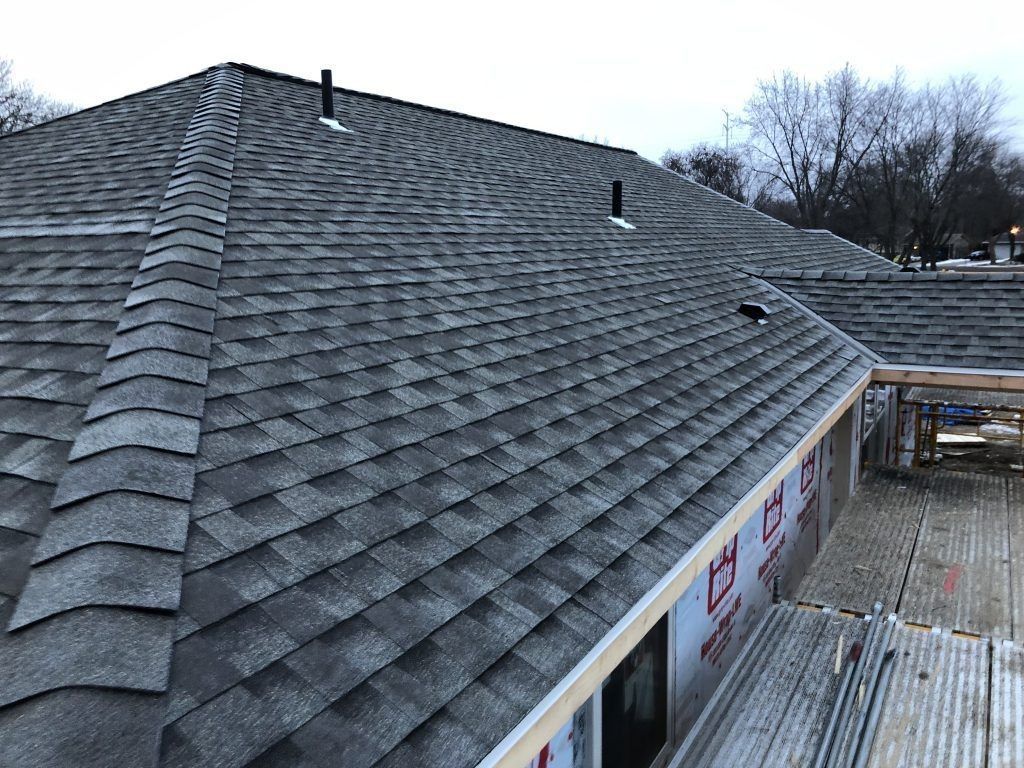 Gray asphalt shingle roof on a residential building.