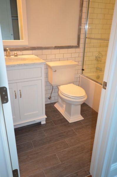 A bathroom with a toilet a sink and a bathtub