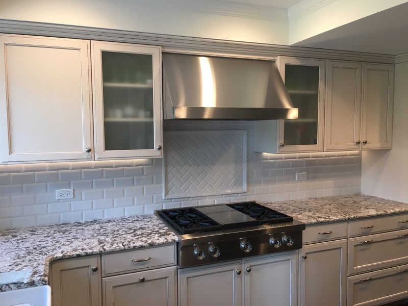 A kitchen with stainless steel appliances and granite counter tops