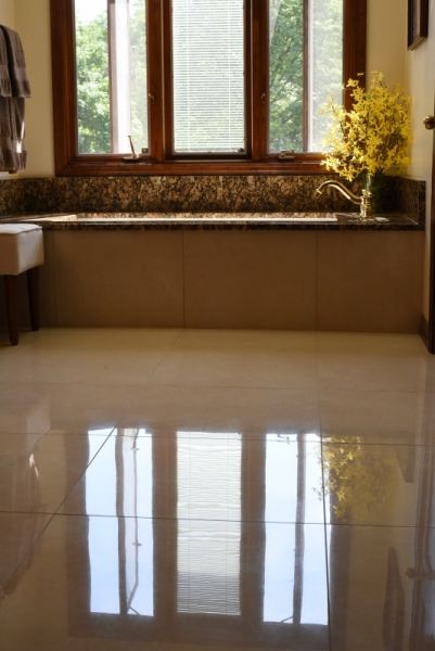 A bathroom with a bathtub and a window