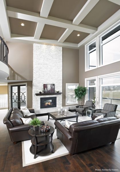 A living room with lots of furniture and a fireplace