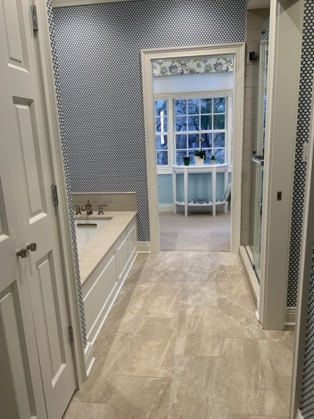 A bathroom with a bathtub and a walk in shower