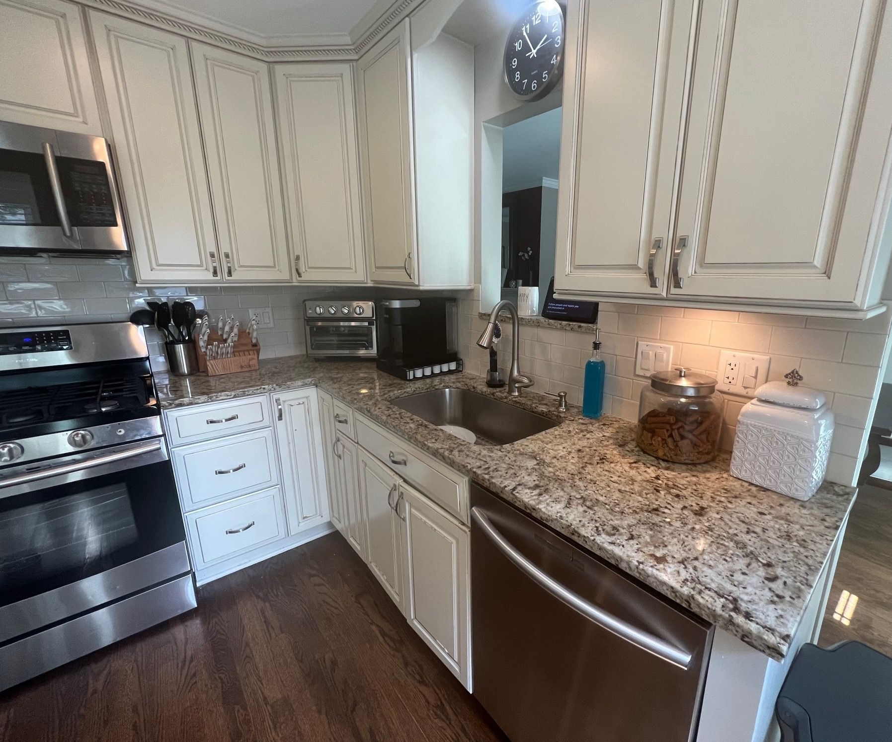 A kitchen with stainless steel appliances and granite counter tops
