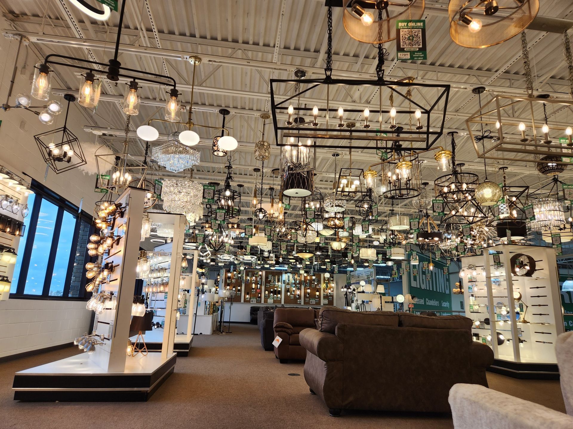 Interior of a lighting store, showcasing various hanging lamps and display fixtures.