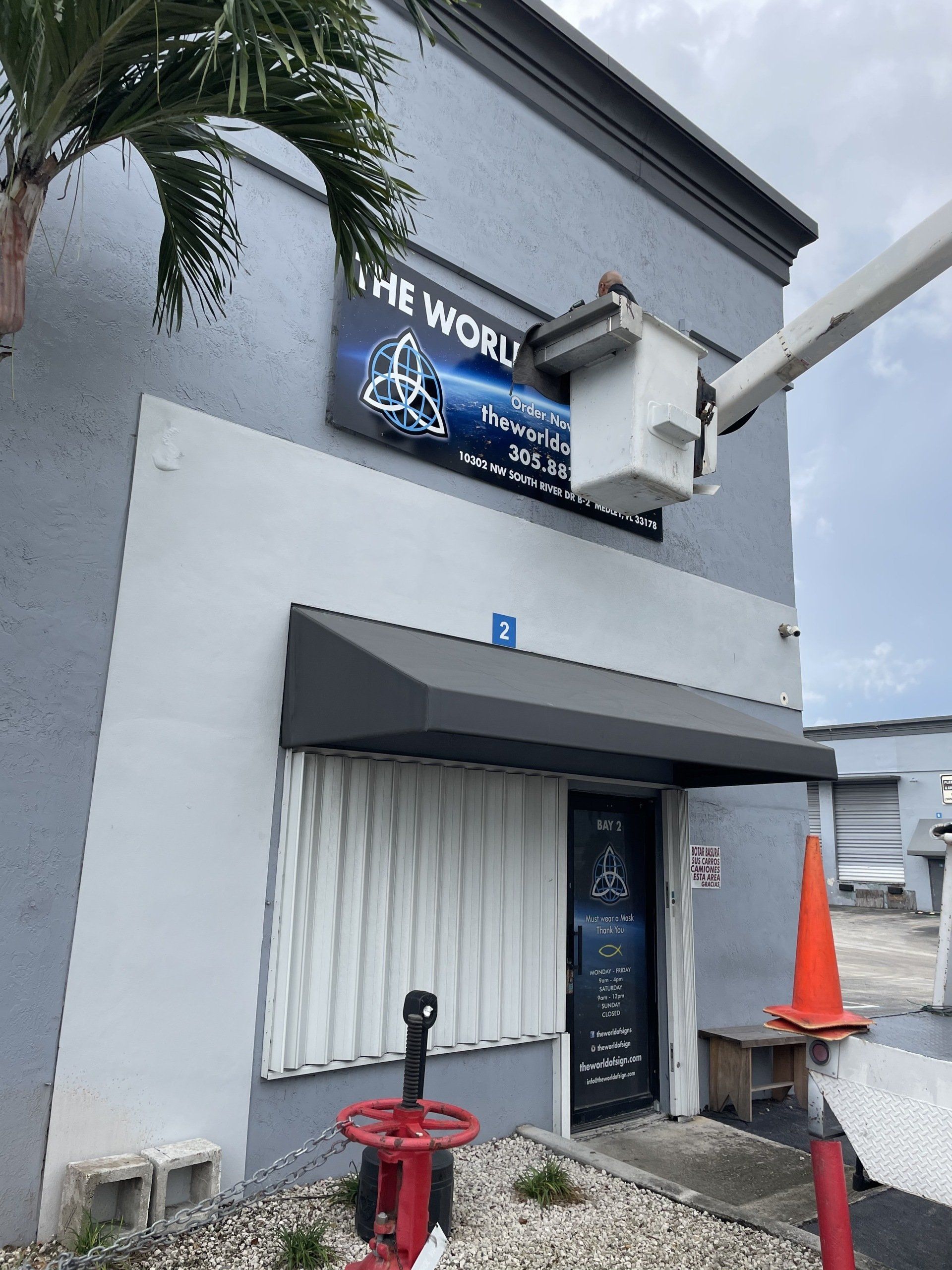 A building with a sign that says the world on it