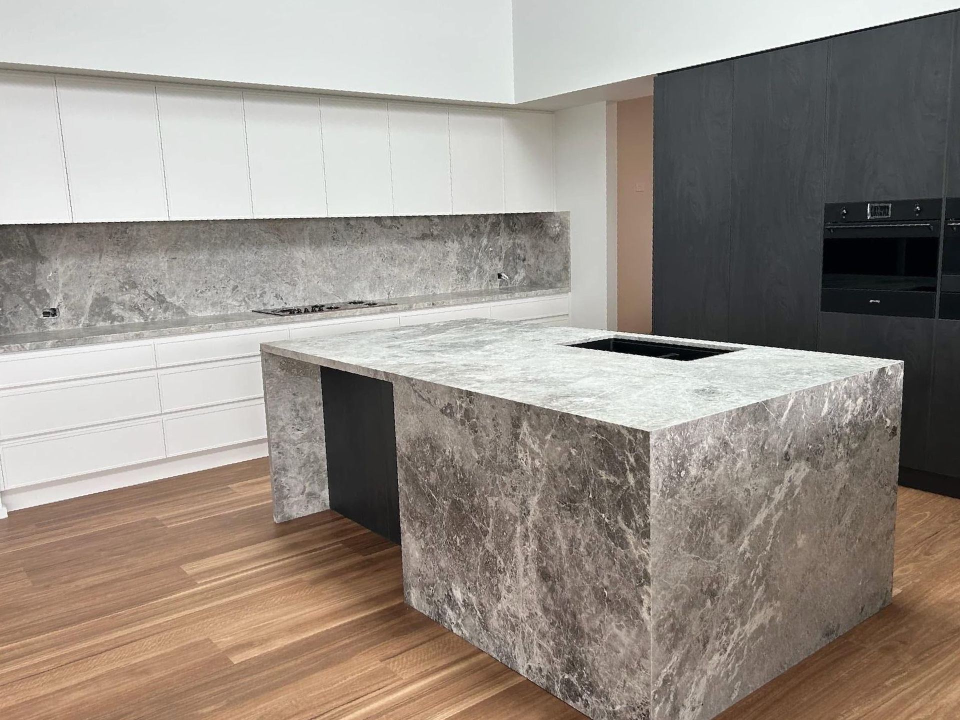 There Is A Large Island In The Middle Of The Kitchen — Content Stone In Trenayr, NSW