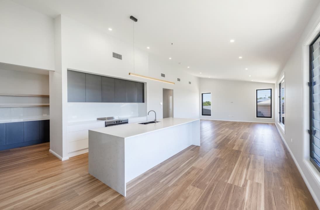 There Is A Large Island In The Middle Of The Kitchen — Content Stone In Trenayr, NSW