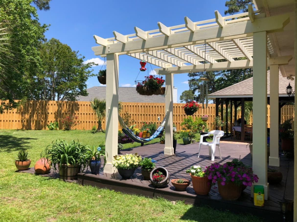 There Is A Hammock Under A Pergola In The Backyard — Content Stone In Coffs Harbour, NSW