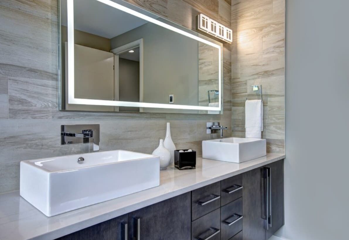 A Bathroom With Two Sinks And A Large Mirror — Content Stone In Glen Innes, NSW