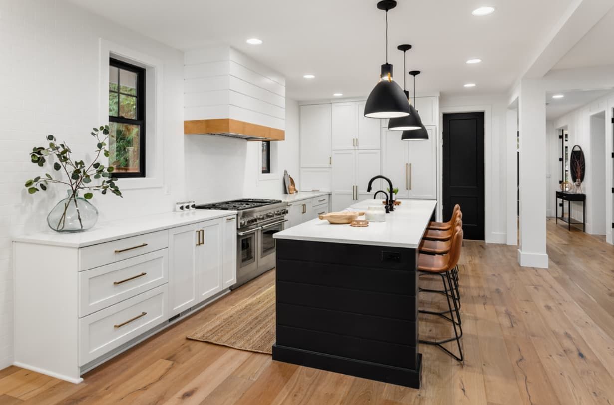 A Kitchen With White Cabinets , Stainless Steel Appliances — Content Stone In Trenayr, NSW