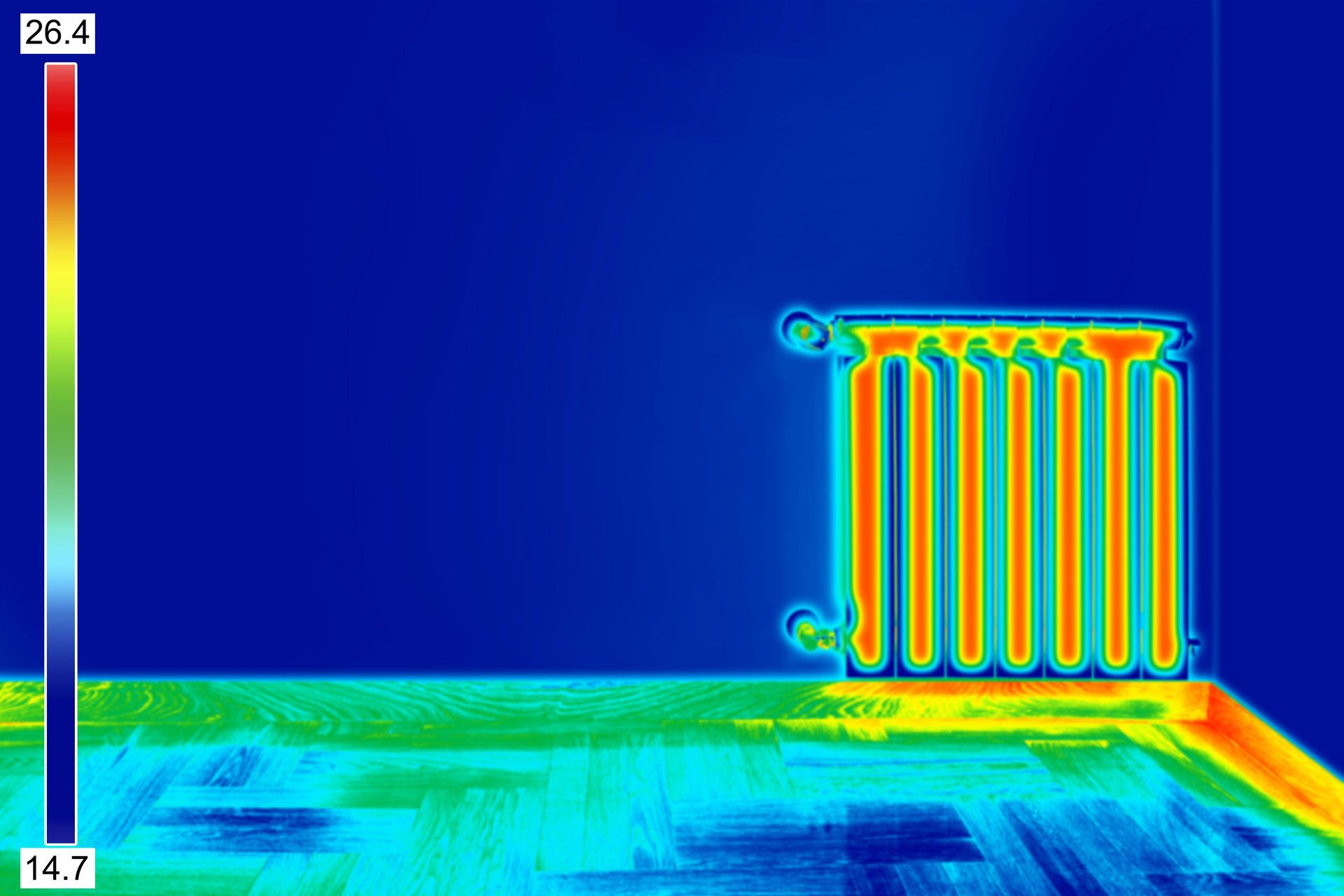 Modern Heating Radiator with Programming Thermostat on orange wall