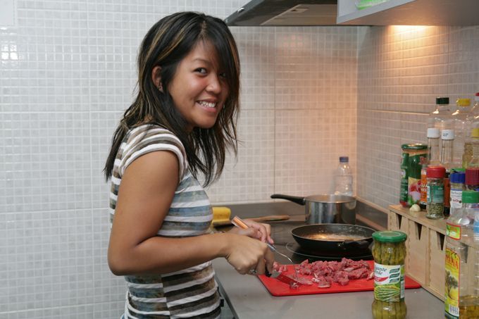 A client is cooking in the kitchen