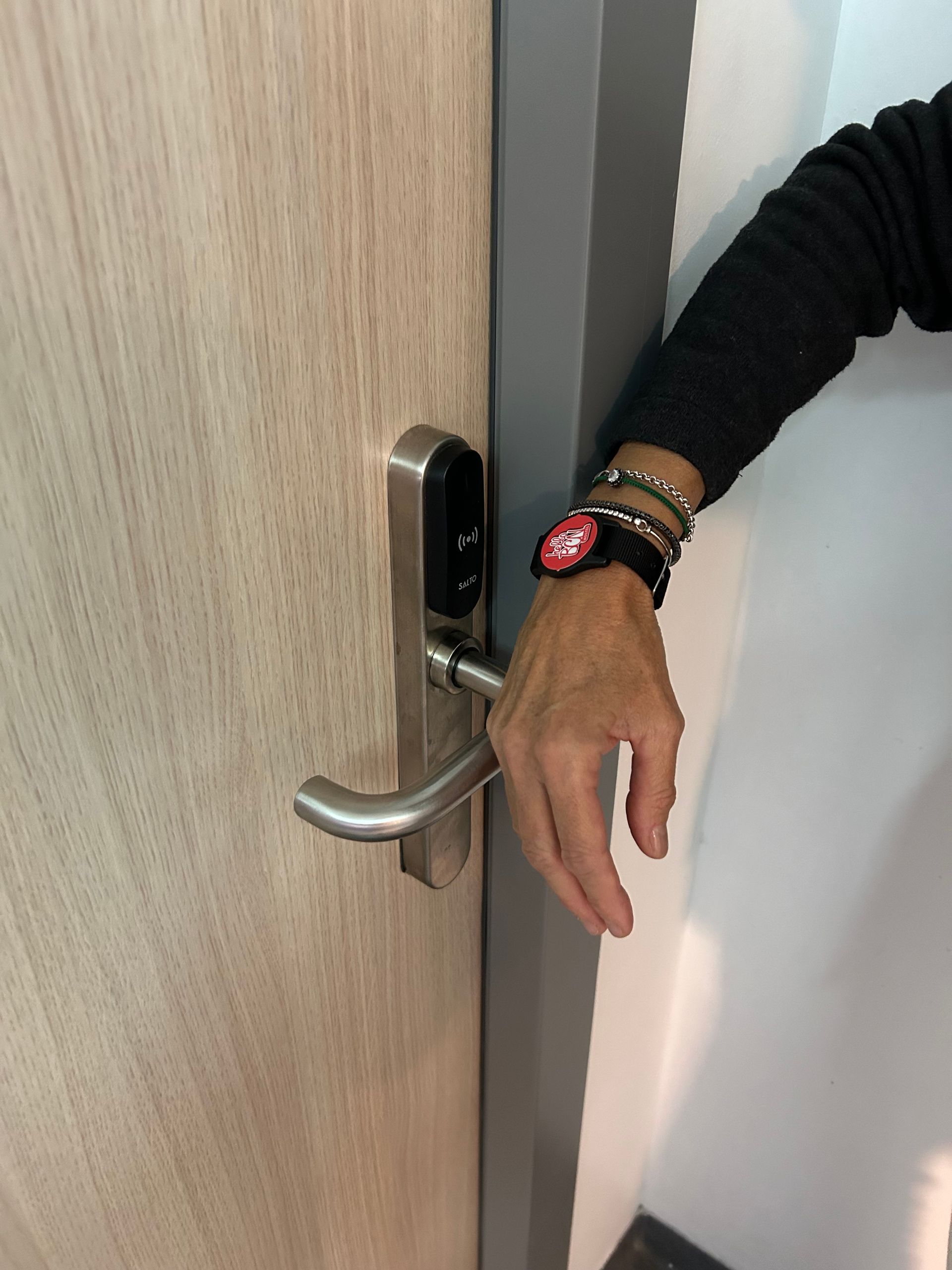 A room with bunk beds and a red wall