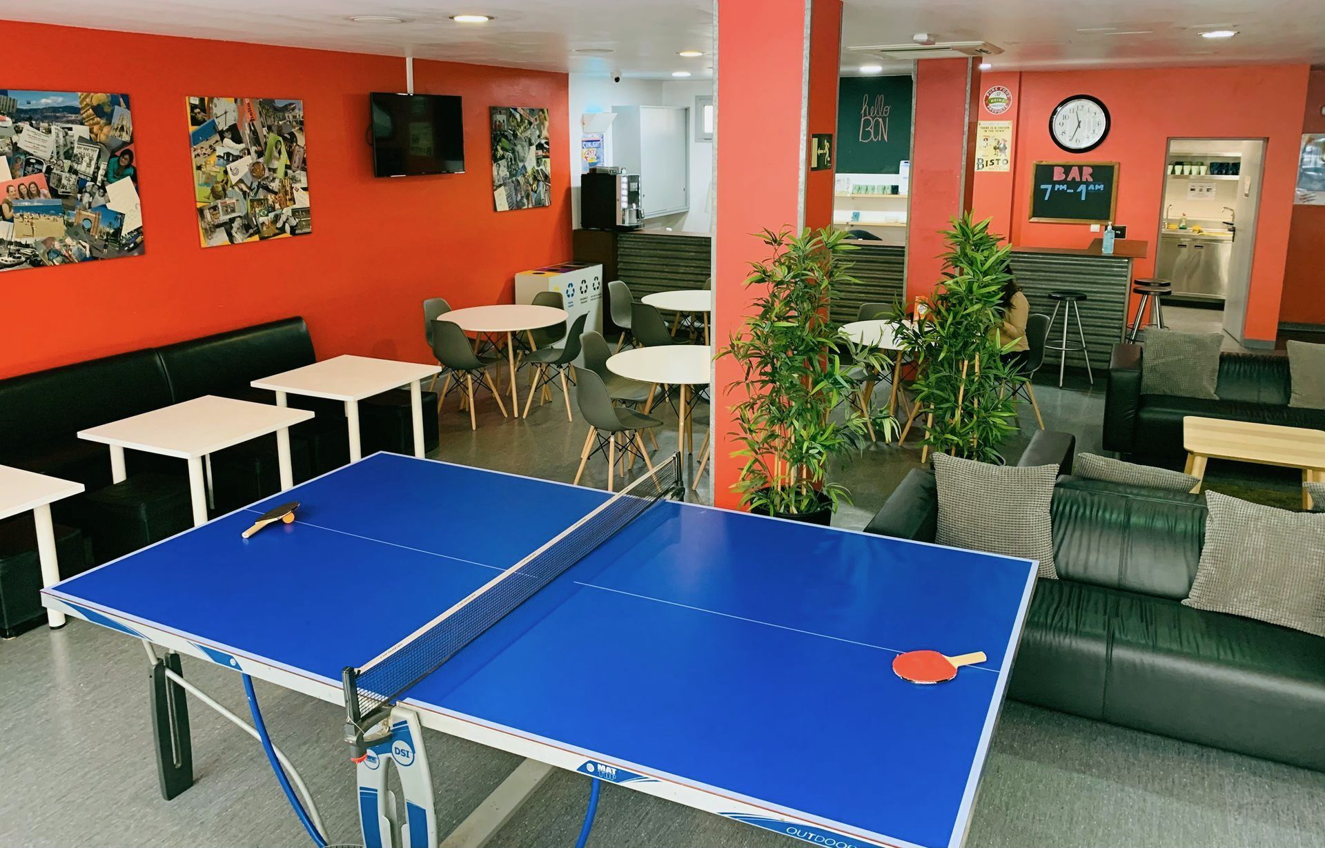 There is a pool table in the middle of the room.