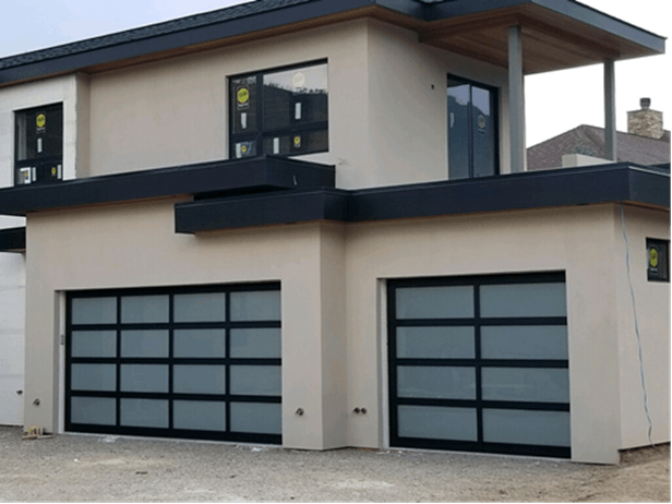 Modern Garage Doors— A Modern Full Vision Garage Door With A White And Black Design in Durango, CO