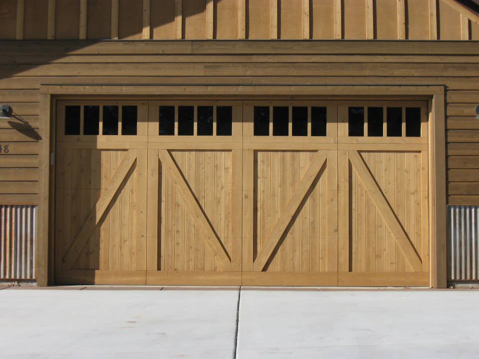 Custom Modern Wood Garage Doors — A Wooden Brown Garage Doors With Customized Design in Durango, CO