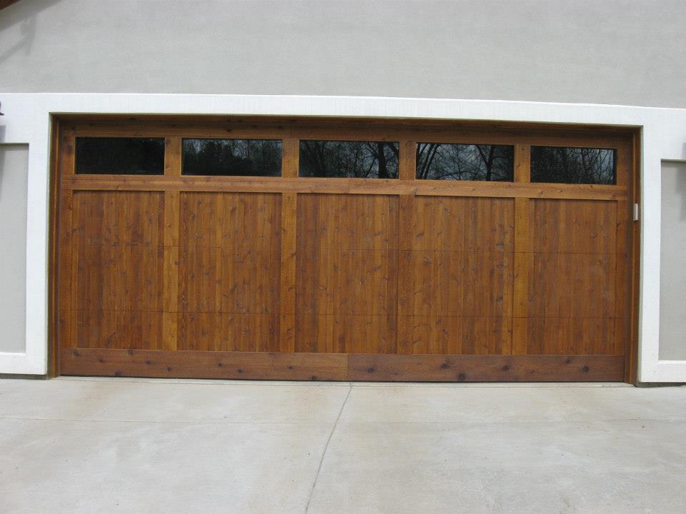 Custom Wood Garage Door — A Customized Wooden Doors With A Glass in Durango, CO