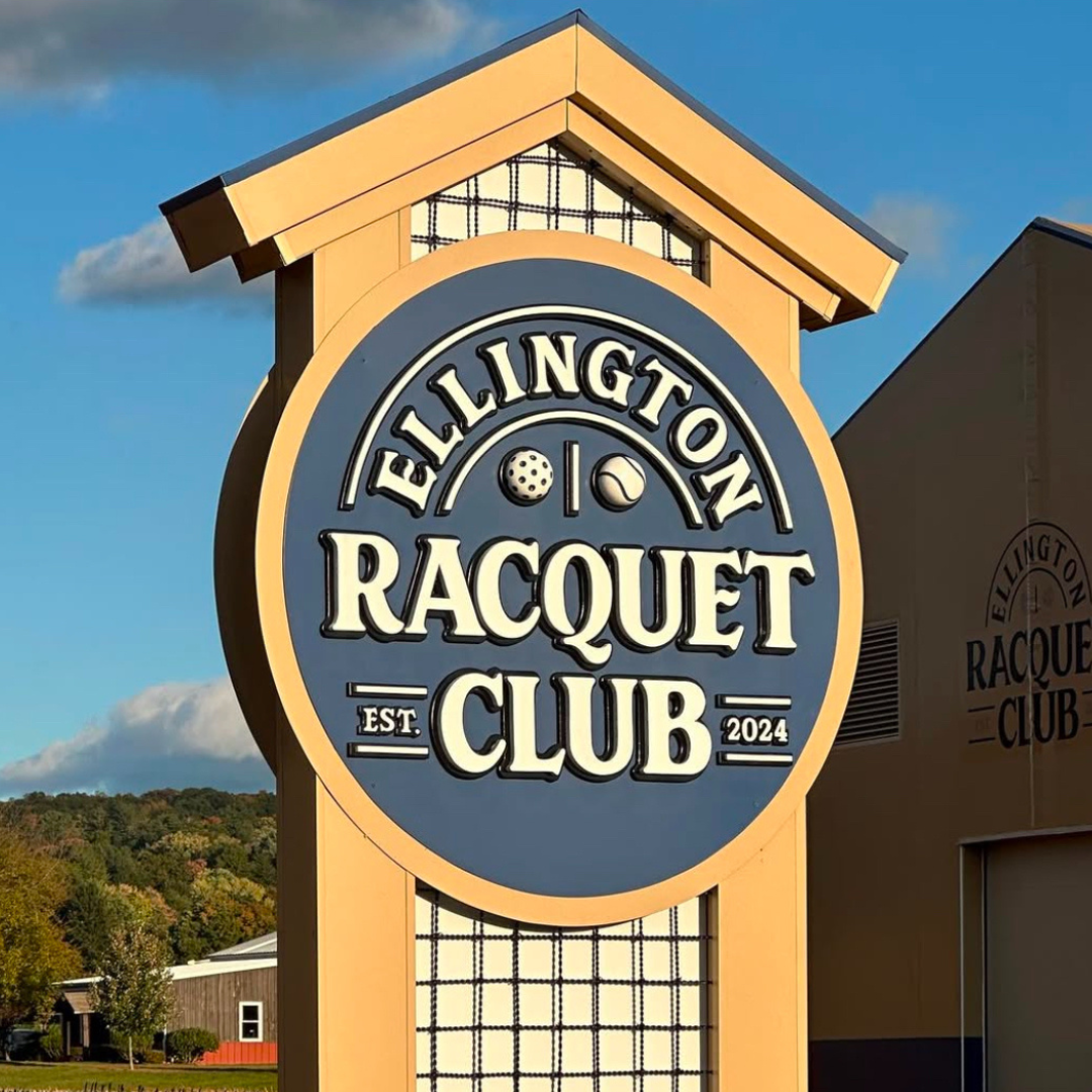 Sign for Ellington Racquet Club, blue and tan, with logo and establishment year.