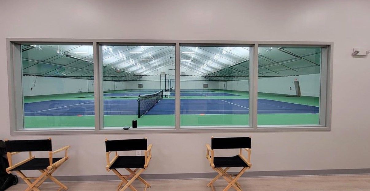 Tennis Courts Behind Window in Ellington Racquet Club