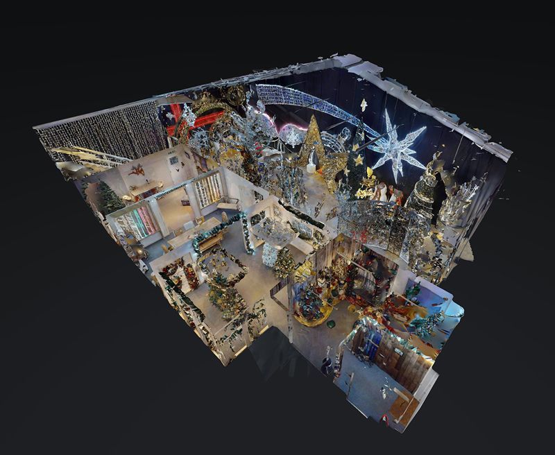 An aerial view of a room decorated for christmas.