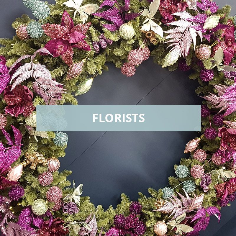 A text box that says Florists with a photo of a wreath with pink decorations
