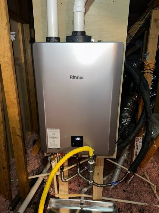 A rinnai water heater is sitting on top of a wooden shelf.