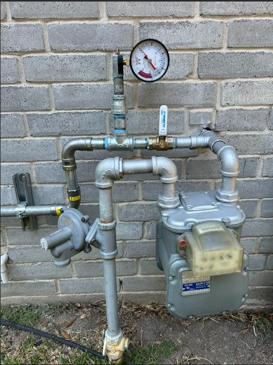 A gas meter with a gauge attached to it