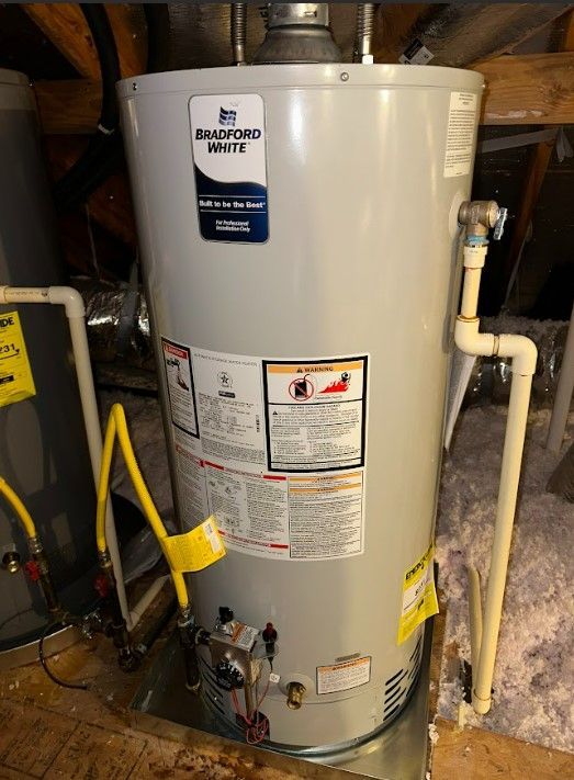 A white water heater is sitting in the attic.