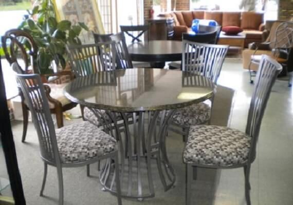 A dining room table and chairs in a living room