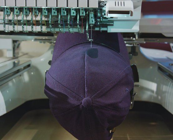 Custom Embroidery — Embroidering On A Cap in Vista, CA