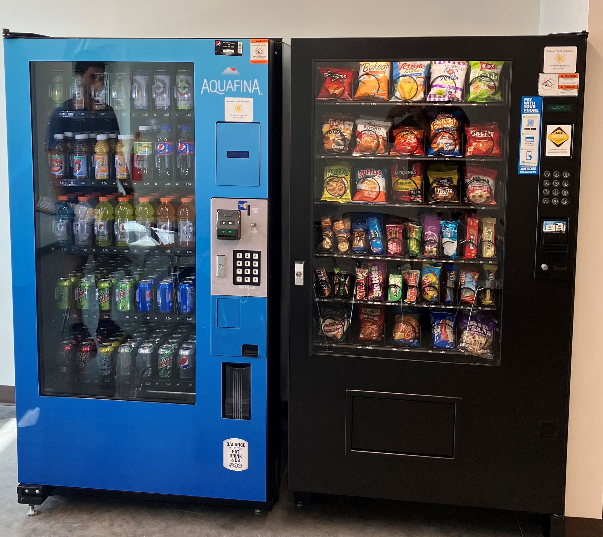 Woman Pressing a Button on A Vending Machine — Orange Park, FL — Northeast Florida Vending Inc