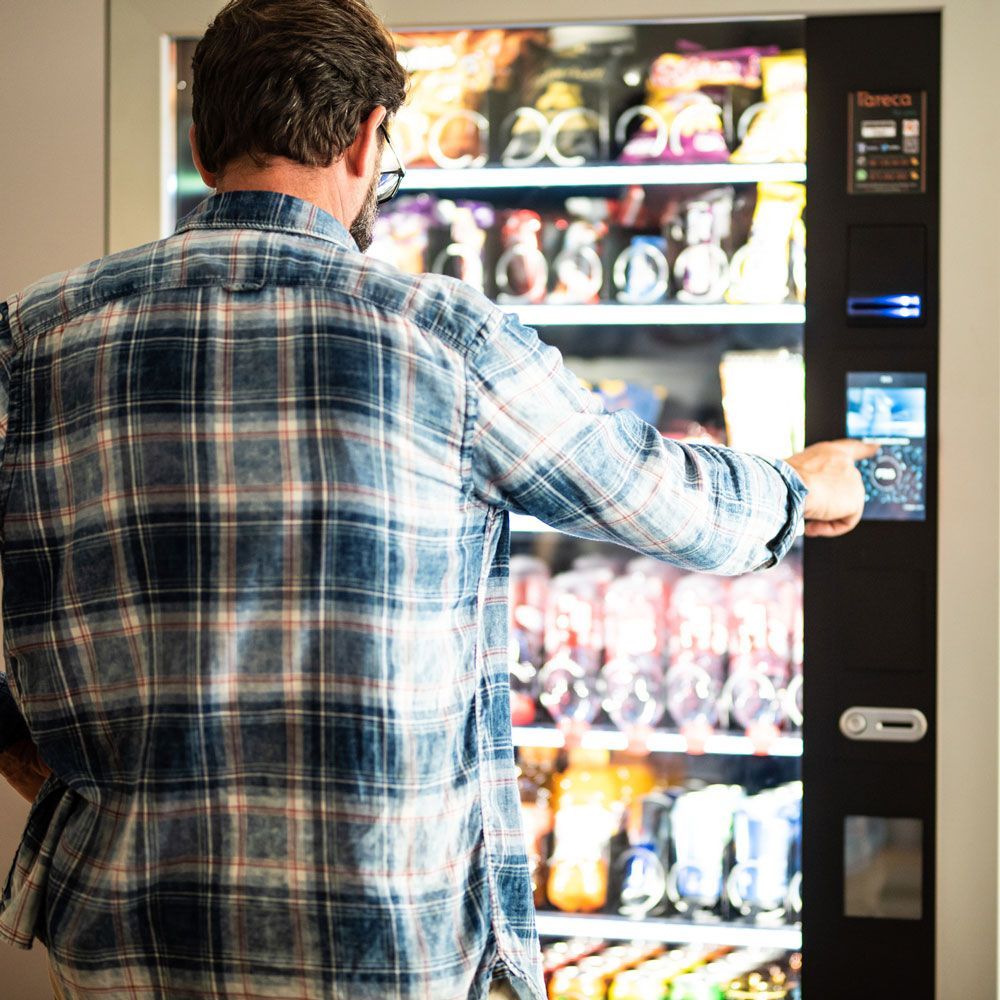 Man Buying a Snack — Orange Park, FL — Northeast Florida Vending Inc