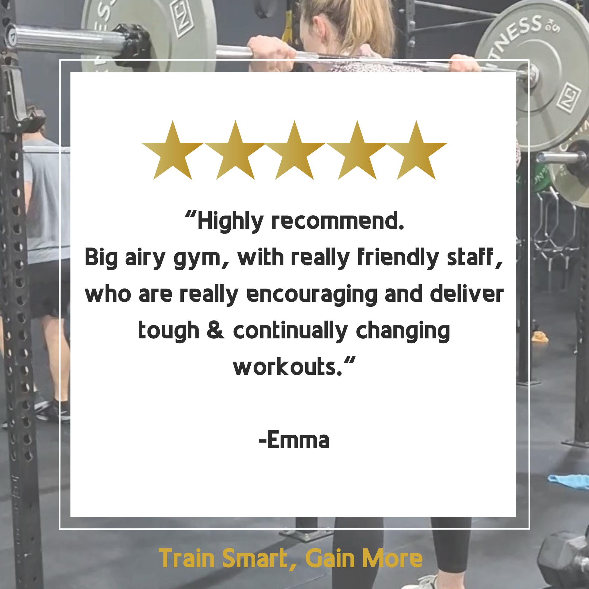 A woman is squatting down with a barbell in a gym.