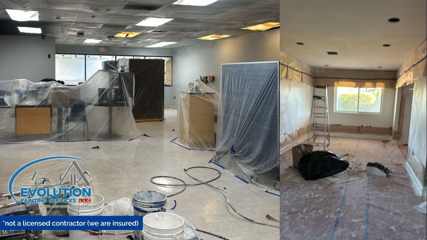 Renovation site with plastic-covered furniture, exposed ceiling, and construction tools on a dusty floor