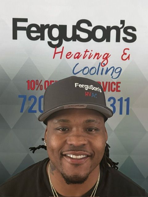A man wearing a hat that says ferguson 's on it