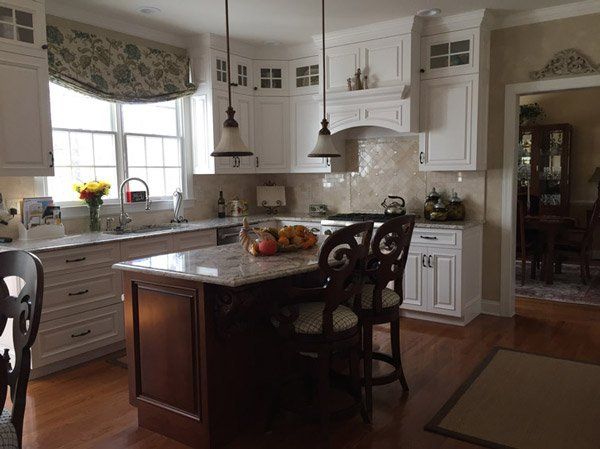 kitchen with tiled walls, island, and countertops
