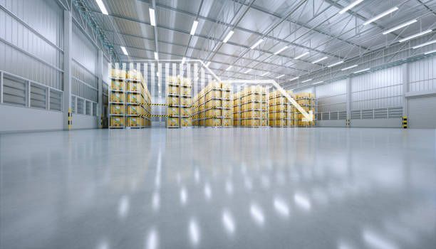 A large warehouse filled with lots of pallets and boxes.