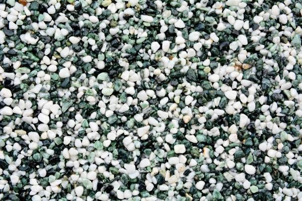 A close up of a pile of green and white gravel.