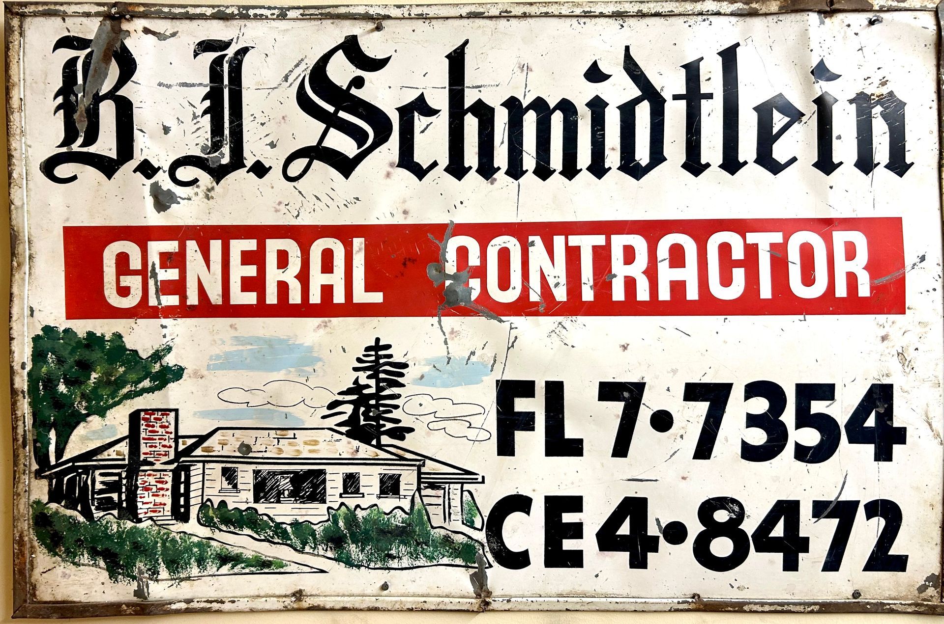 A sign for b.j. schmidtlein general contractor